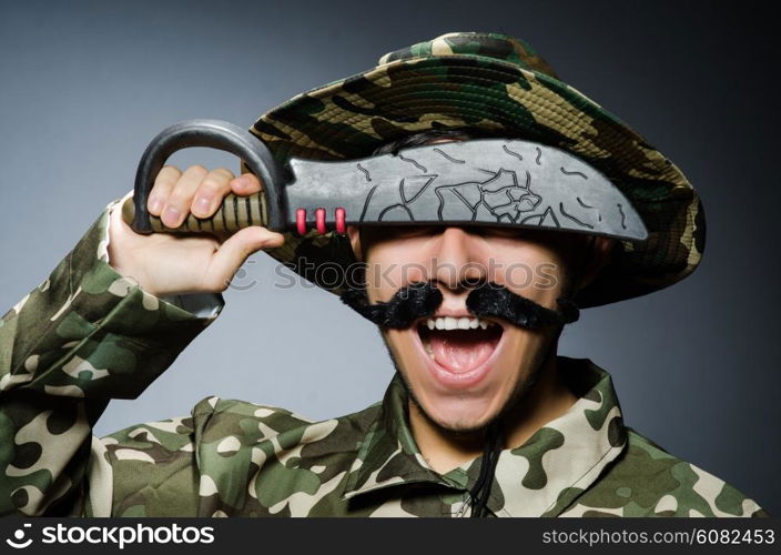 Funny soldier against the dark background