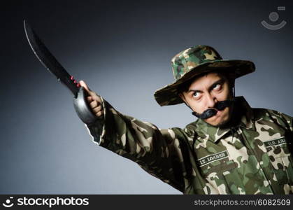 Funny soldier against the dark background