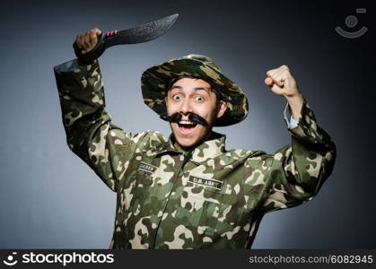 Funny soldier against the dark background