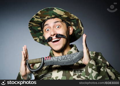 Funny soldier against the dark background