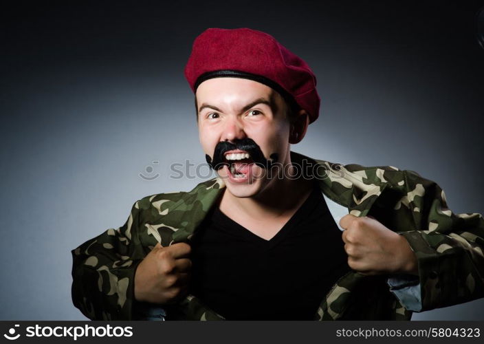 Funny soldier in military concept