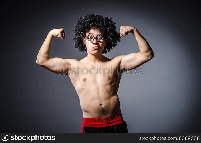 Funny sportsman sporting his muscles