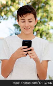 Funny teenage boy looking at the mobile