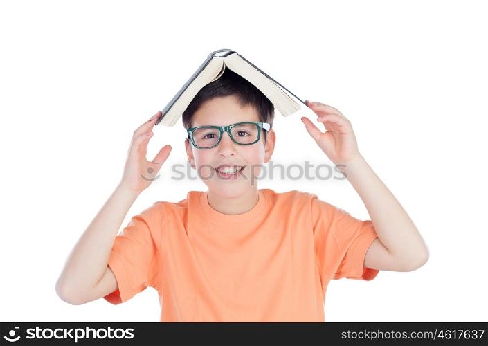 Funny teenage boy of thirteen with a book on head isolated on white background