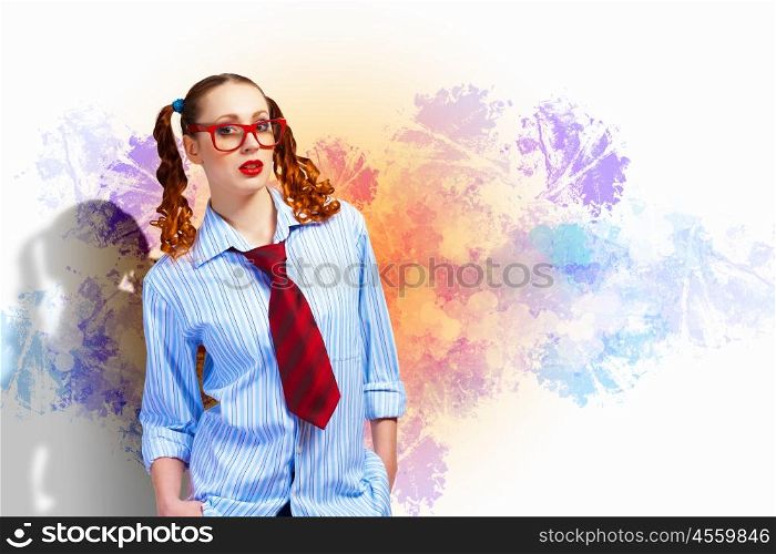 Funny teenager girl. Image of confident teenager girl in red glasses