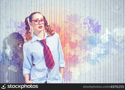 Funny teenager girl. Image of confident teenager girl in red glasses