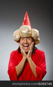 Funny wizard wearing red dress