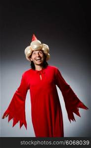 Funny wizard wearing red dress