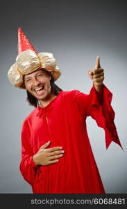 Funny wizard wearing red dress