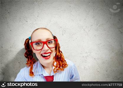 Funny woman. Funny looking red-hair woman with glasses staring at camera