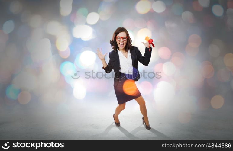 Funny woman in red glasses. Young funny woman in suit against bokeh background