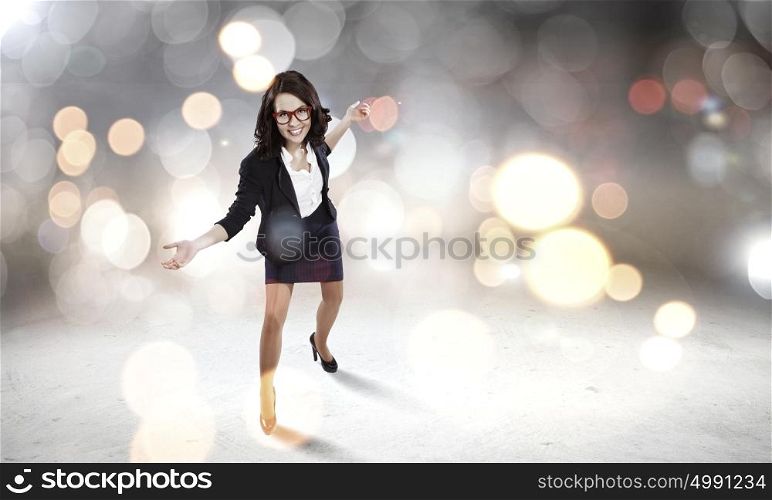 Funny woman in red glasses. Young funny woman in suit against bokeh background