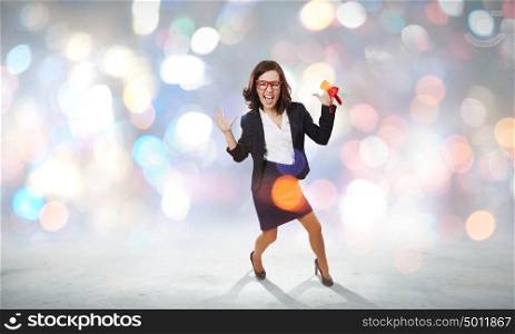 Funny woman in red glasses. Young funny woman in suit against bokeh background