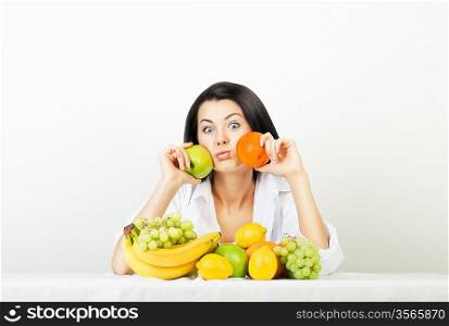 funny woman with apple and orange