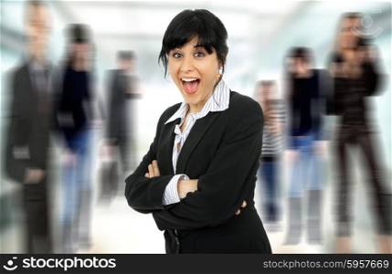 funny young business woman portrait with some people on the back
