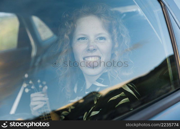 funny young woman fooling around car