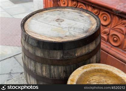 furniture and object concept - close up of old wooden barrel table at bar or pub outdoors. close up of old wooden barrel table outdoors