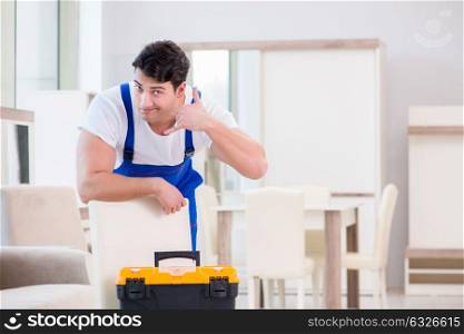 Furniture repairman working in store