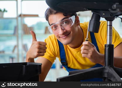 Furniture repairman working on repairing the chair