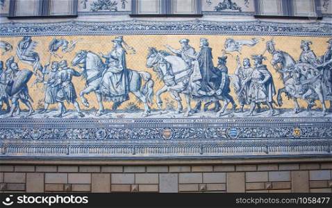 Furstenzug is a giant mural decorates the wall. Dresden, Germany. It depicts to celebrate the 800 year anniversary of the Wettin Dynasty.. Furstenzug is a giant mural decorates the wall