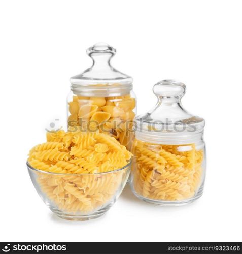 Fusilli and conchiglioni in glass jar isolated on white background. Two different types of raw pasta in glass jars, ingredient for cook, traditonal italian cuisine.