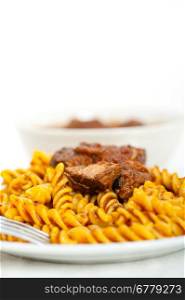 fusilli pasta al dente with neapolitan style ragu meat sauce very different from bolognese style