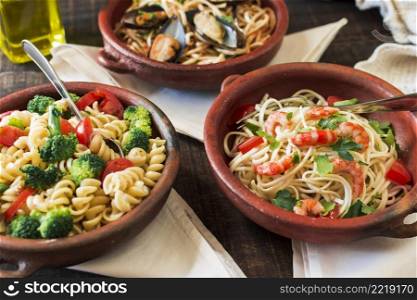 fusilli spaghetti pasta earthenware table with napkins
