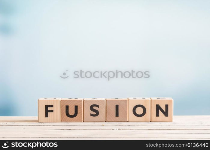 Fusion message made of wooden cubes on a table