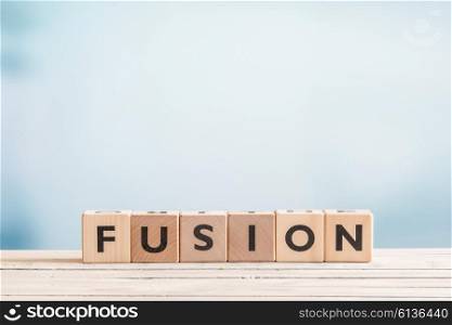 Fusion message made of wooden cubes on a table