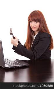 Fustrated businessman in her office threatening to destroy her PC with a hammer out of sheer frustration
