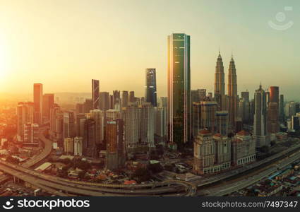 Future 3d modern neon light design skyscraper mix in sunrise Kuala Lumpur city skyline , future vision of modern city , mixed media .