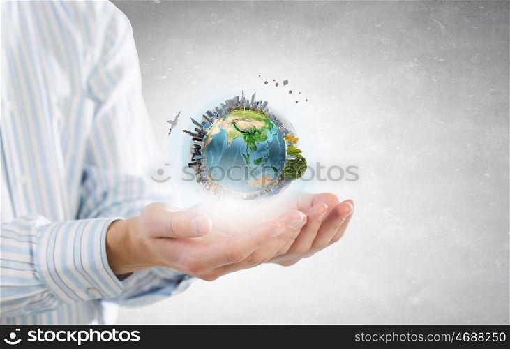 Future of our planet in your hands. Close up of human hands holding Earth planet. Elements of this image are furnished by NASA