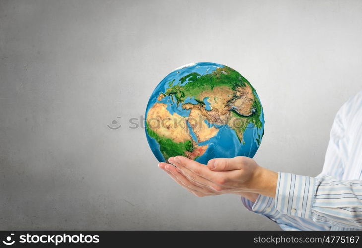 Future of our planet in your hands. Close up of human hands holding Earth planet. Elements of this image are furnished by NASA