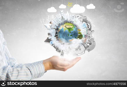 Future of our planet in your hands. Close up of human hands holding Earth planet. Elements of this image are furnished by NASA