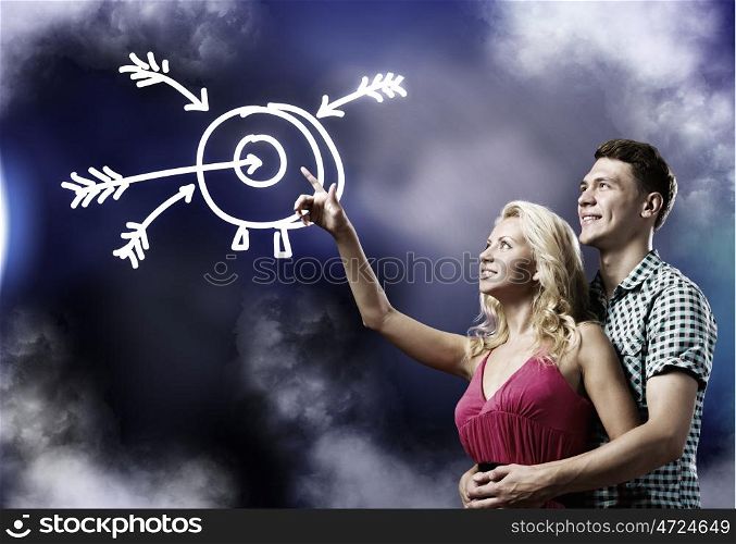 Future planning. Young happy couple dreaming about future successful life