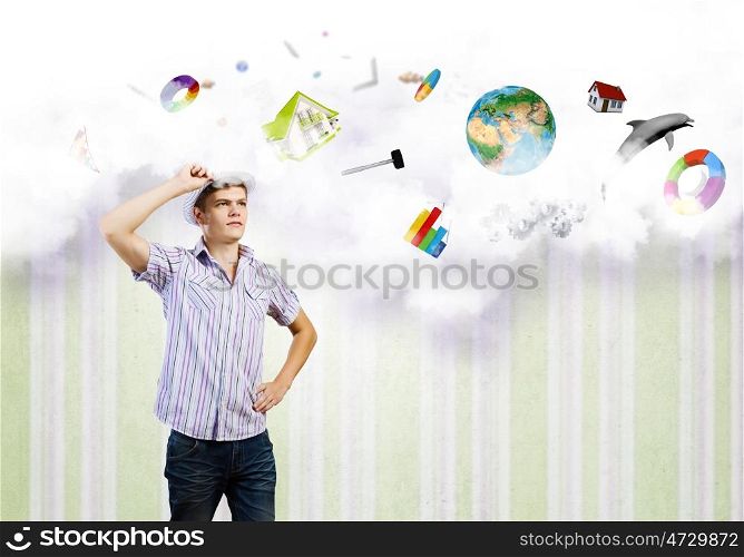 Future plans. Young man in casual dreaming about future. Elements of this image are furnished by NASA