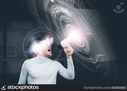 Future technologies. Young man in white screaming in megaphone against media background