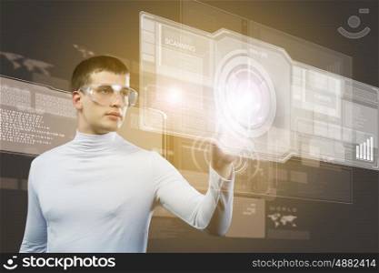 Future technologies. Young man in white touching icon of media screen