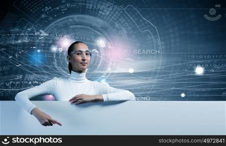 Future technologies. Young pretty woman with white blank banner