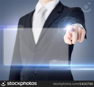 future technology and business concept - male hand touching virtual screen