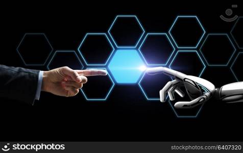 future technology, artificial intelligence and business concept - robot and human hand touching virtual network hologram over black background. robot and human hand touching network hologram