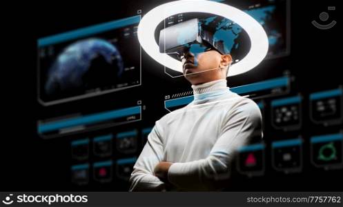 future technology, augmented reality and cyberspace concept - man vr glasses under white illumination with virtual screens projection over black background. man in virtual reality headset or vr glasses