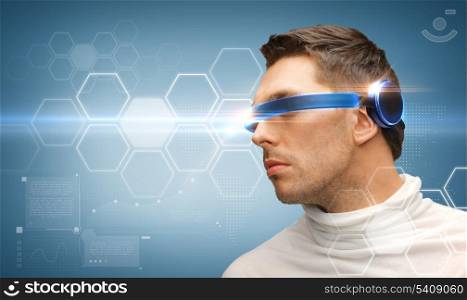 future technology concept - handsome man with futuristic glasses