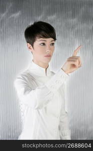 futuristic androgynous businesswoman touchpad finger touching pad