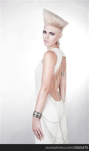 futuristic attractive woman in dress with creative hairstyle