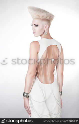 futuristic beautiful woman in dress with creative hairstyle