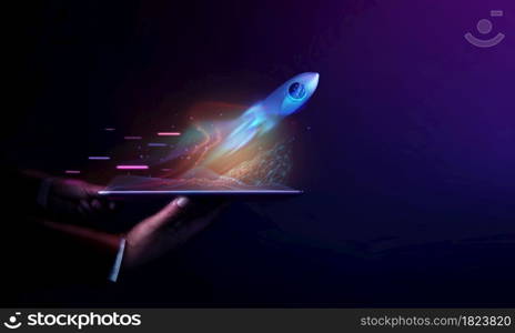 Futuristic Conceptual Photo. Startup Concept. Rocket Take-off and Released from Digital Tablet to Space. Mission to Moon. Symbol of Success