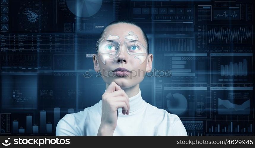 Futuristic girl in virtual room. Virtual holographic interface and young thoughtful woman wearing glasses