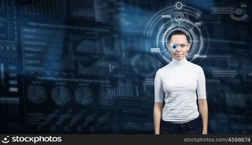 Futuristic girl in virtual room. Virtual holographic interface and young woman wearing glasses