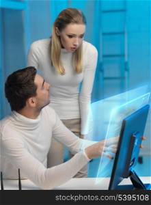futuristic man and woman working with virtual screen